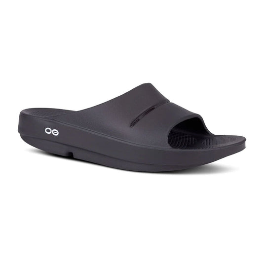 Black slide sandal with 'oo' logo on a white background