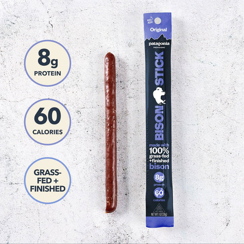 Bison stick with packaging and nutritional information on a textured white background