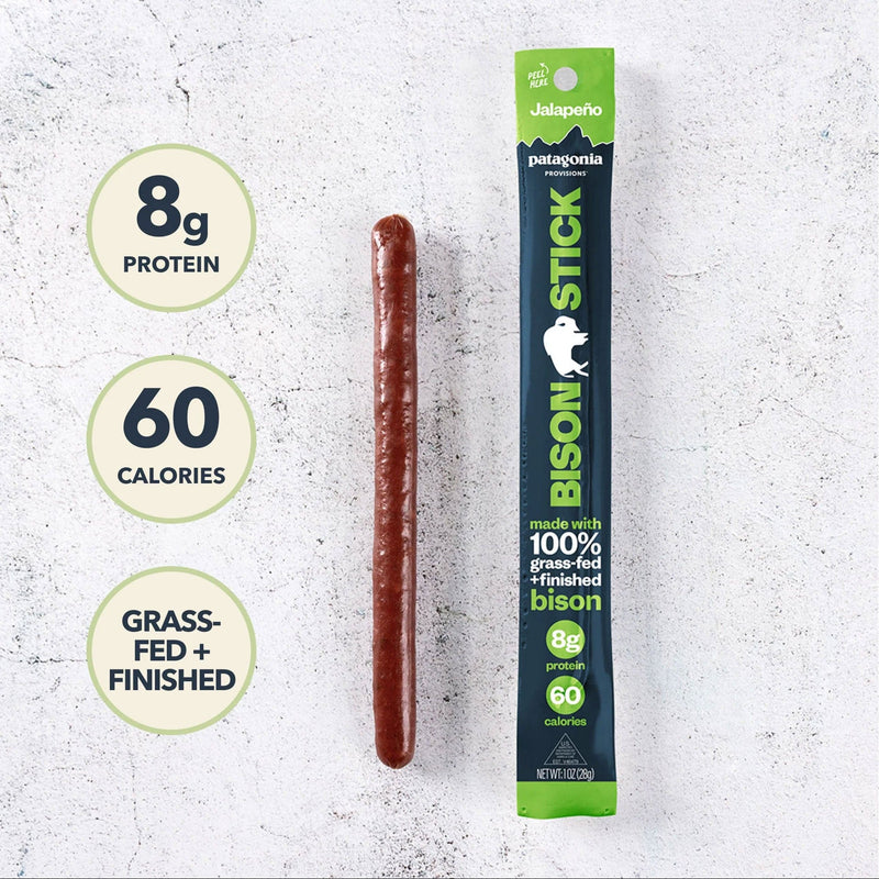 Load image into Gallery viewer, Bison stick with packaging on a textured white background, showing protein and calorie information.
