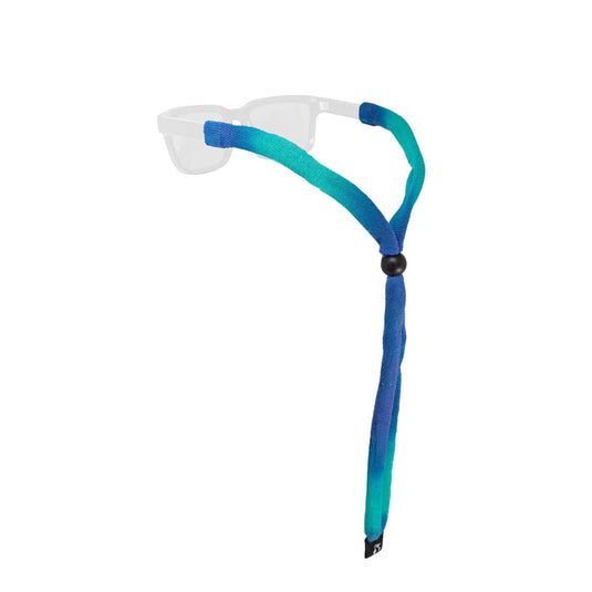 Goggles with a gradient blue and green strap on a white background
