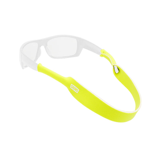 A pair of white sport sunglasses with a bright neon yellow silicone strap, shown on a clean white background.