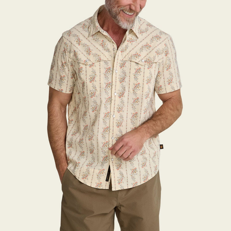 Load image into Gallery viewer, Man wearing a patterned shirt and beige pants on a plain background
