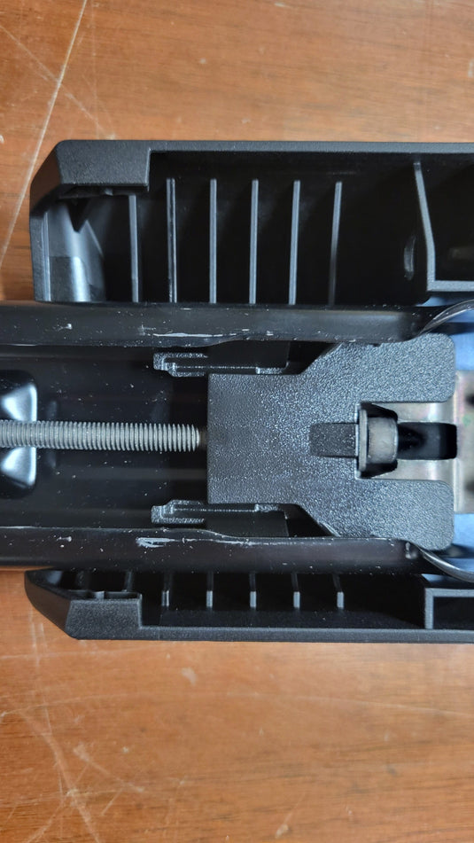 Close-up of a mechanical component on a wooden surface