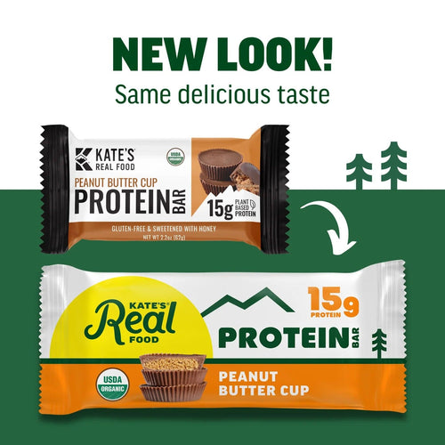 Two versions of Kate's Real Food peanut butter cup protein bar packaging with a green background and trees.