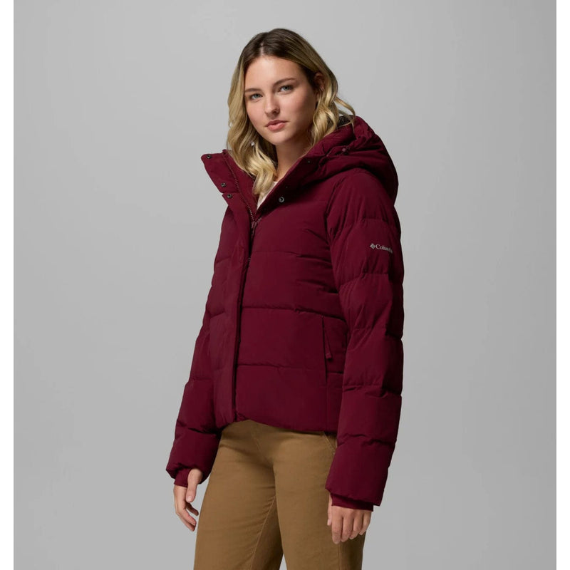Load image into Gallery viewer, Woman wearing a maroon puffer jacket on a gray background
