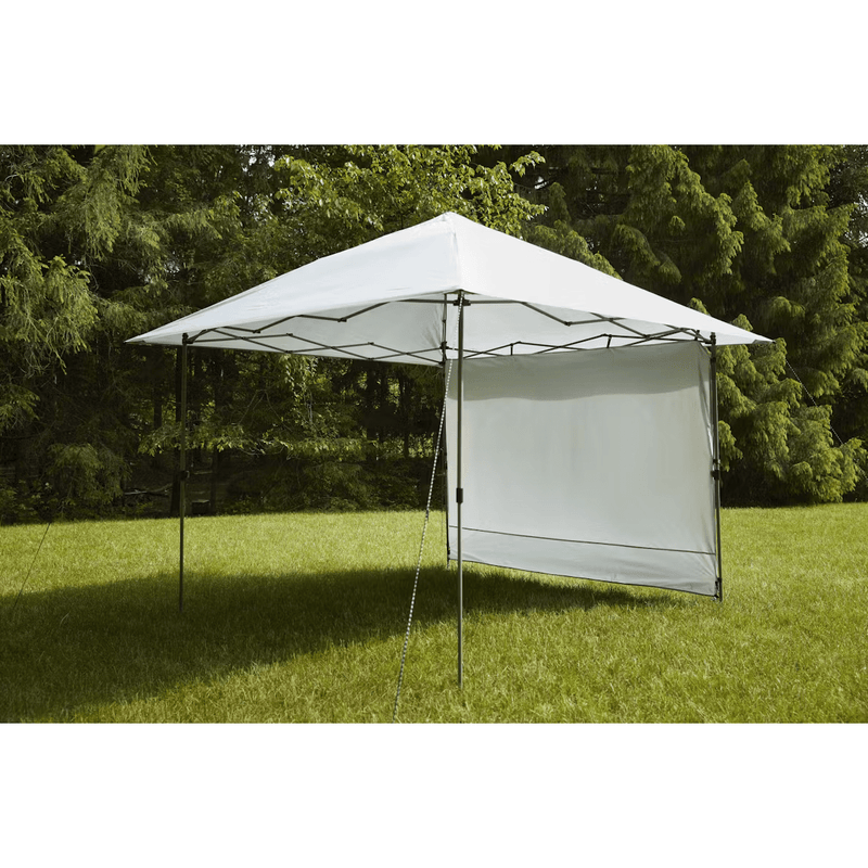 Load image into Gallery viewer, Outdoor canopy tent with side panels set up on grass with trees in the background
