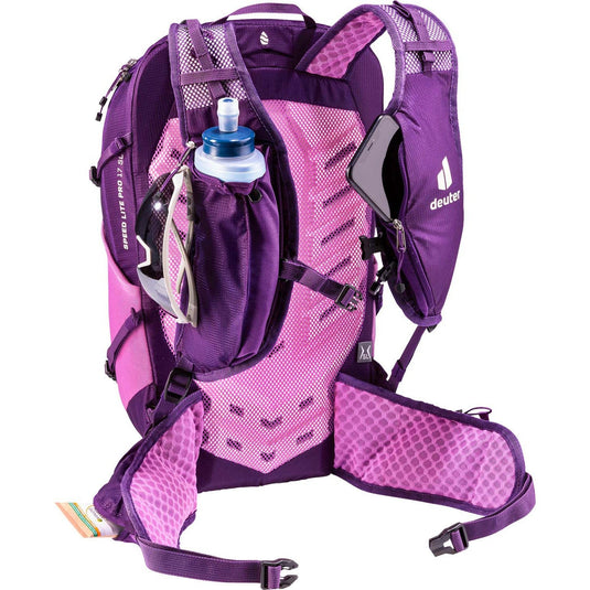 Purple and pink hydration backpack with water bottle on a white background
