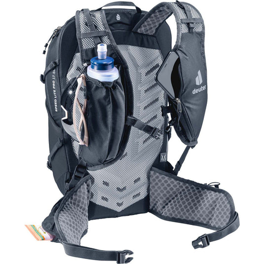 Gray and black hydration backpack with water bottle on a white background