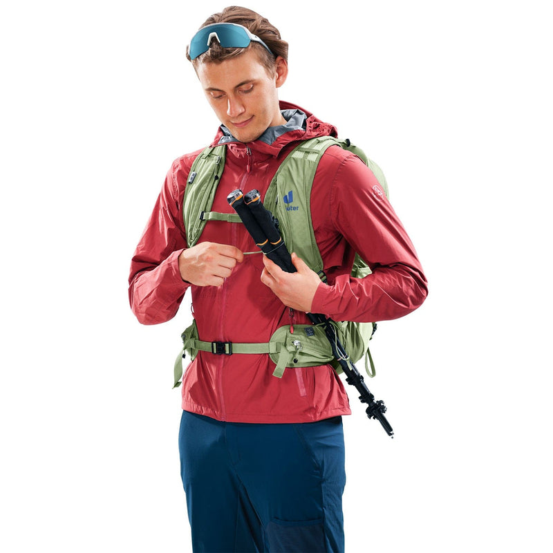 Load image into Gallery viewer, Man wearing a red jacket and green backpack holding a rifle on a white background
