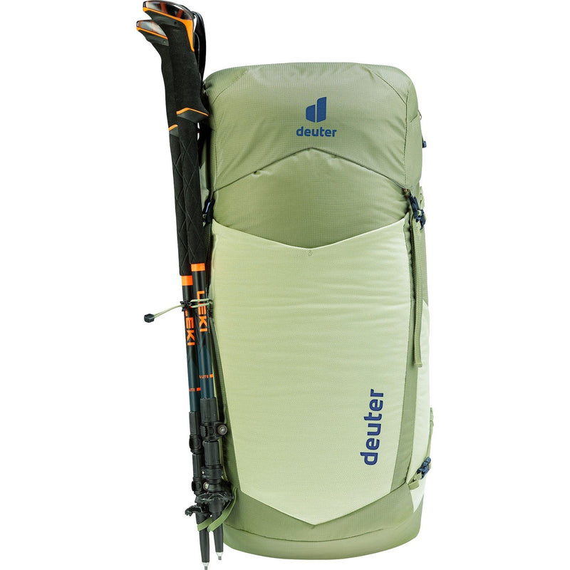 Load image into Gallery viewer, Green hiking backpack with poles attached on a white background
