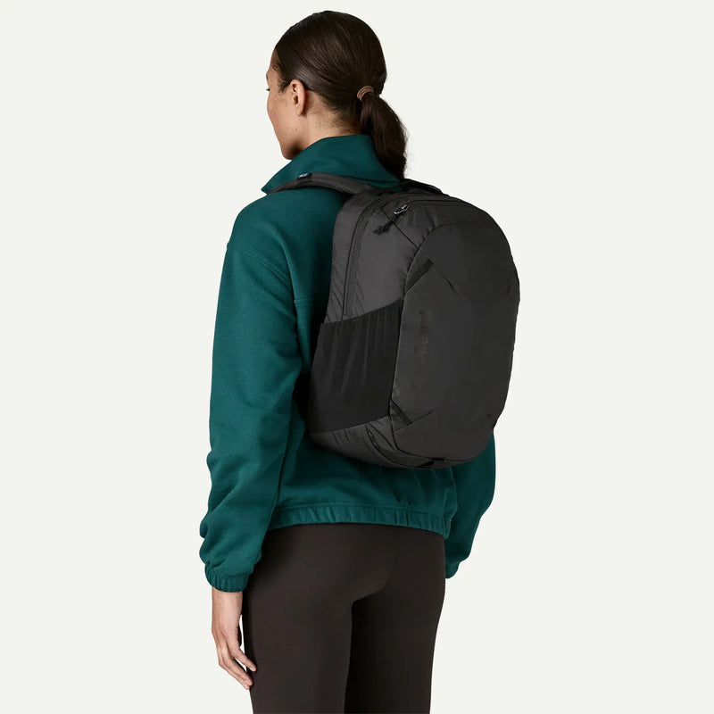 Load image into Gallery viewer, Person wearing a black backpack on a white background
