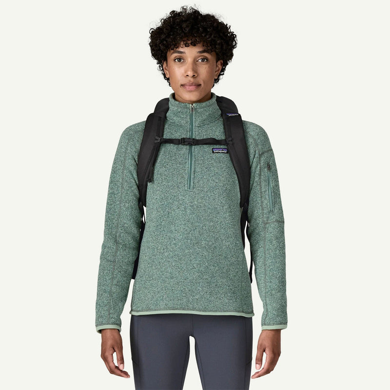 Load image into Gallery viewer, Person wearing a green fleece pullover with a black backpack on a white background

