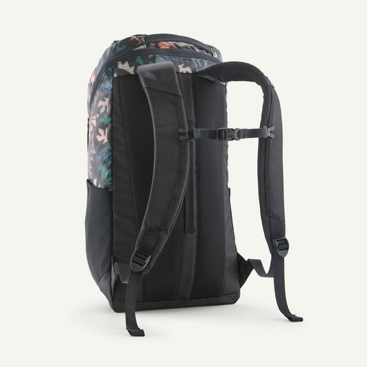 Black backpack with floral pattern on the back on a white background