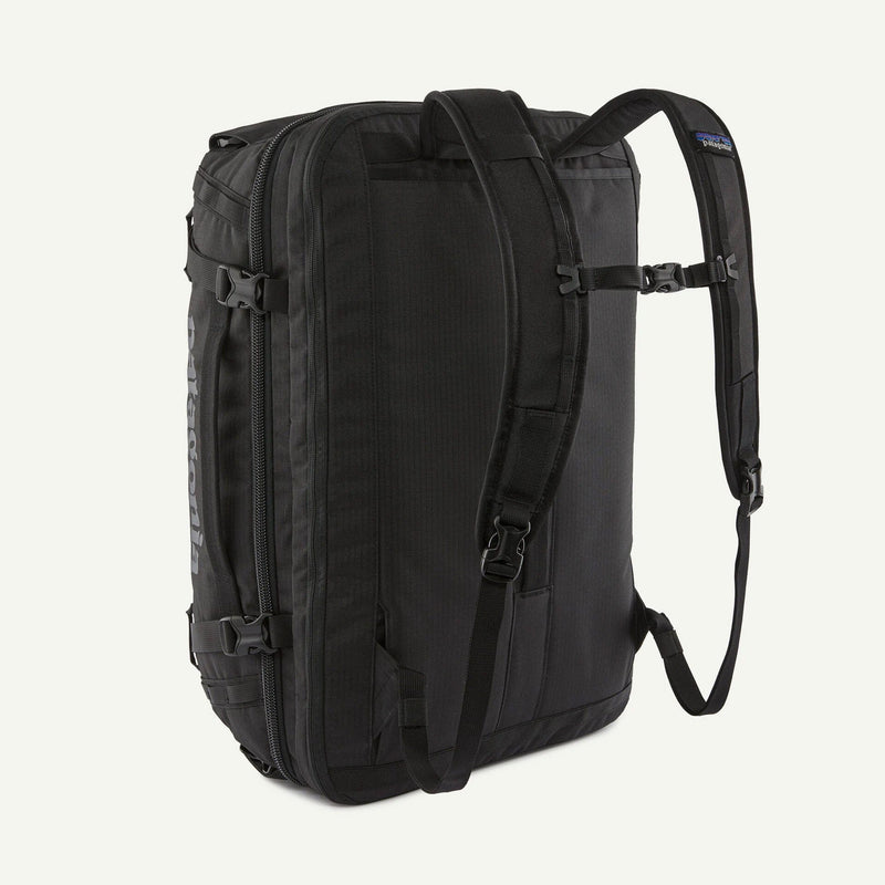 Load image into Gallery viewer, Black backpack on a light gray background
