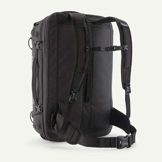 Black backpack with multiple straps on a white background