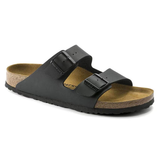 Black sandal with cork footbed on a white background