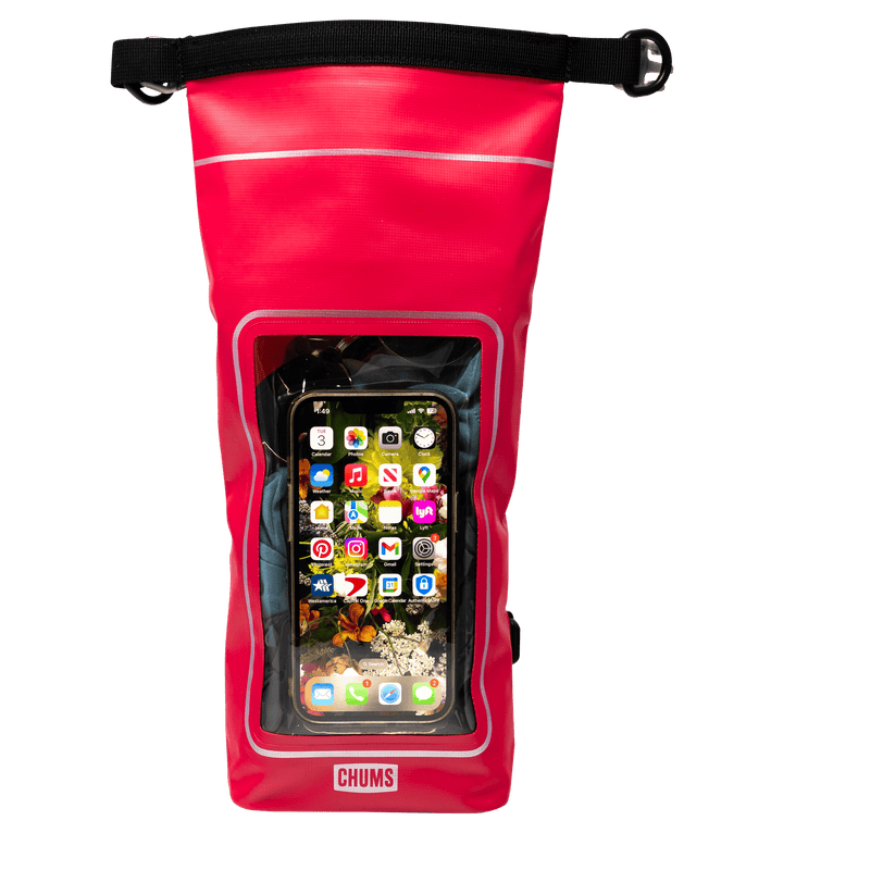 Load image into Gallery viewer, A red waterproof phone pouch with a clear front window showing a smartphone inside, featuring a black strap at the top and the brand name CHUMS on the bottom.

