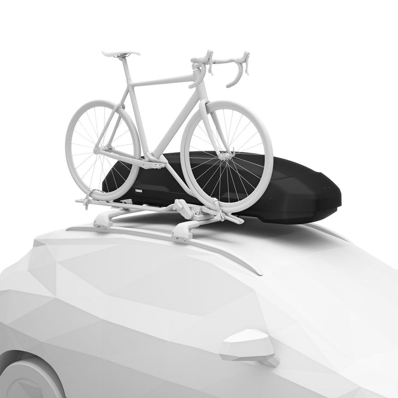 Load image into Gallery viewer, White bicycle on a car roof rack with a black cover on a white background
