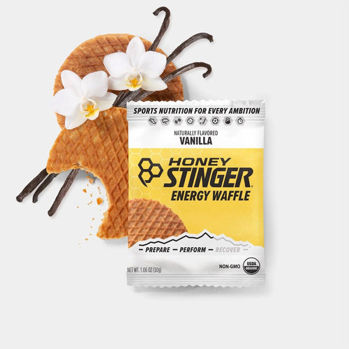 Honey Stinger vanilla energy waffle with packaging on a white background