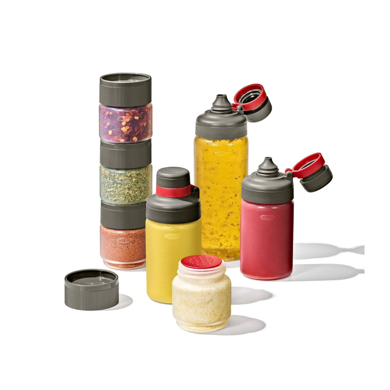 Load image into Gallery viewer, Set of colorful spice jars with various spices on a white background
