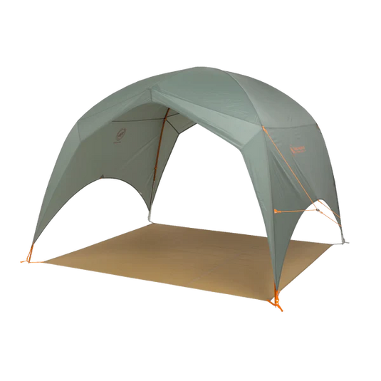 Green camping tent with a brown groundsheet on a white background