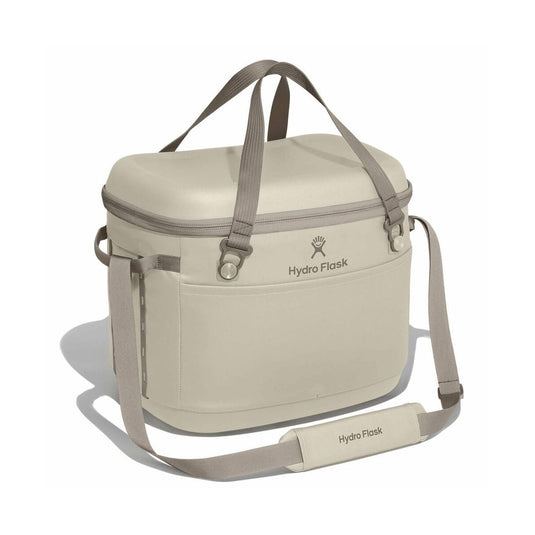 Beige cooler bag with shoulder strap on a white background, featuring Hydro Flask logo.
