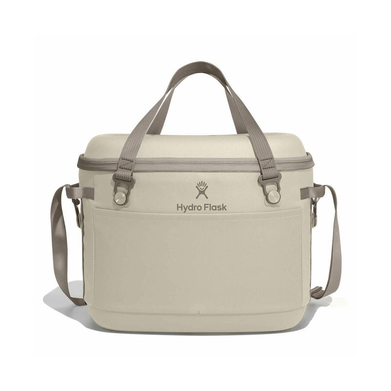 Load image into Gallery viewer, Beige cooler bag with shoulder straps on a white background, featuring the Hydro Flask logo.
