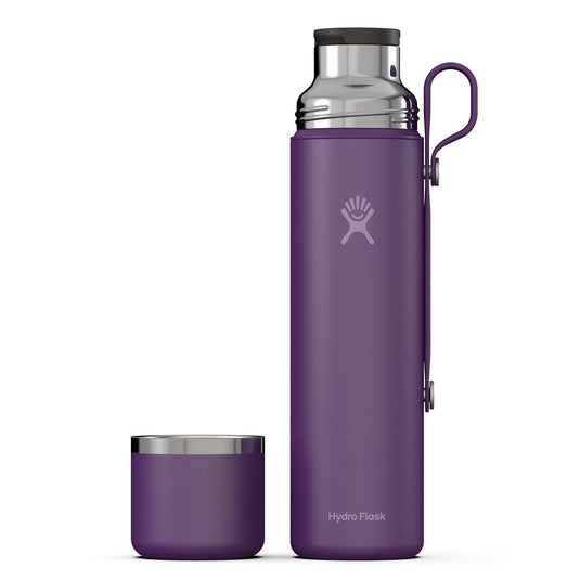 Purple Hydro Flask water bottle with a matching small container on a white background