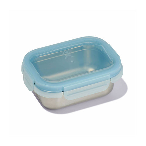 Rectangular glass food container with blue lid on a white background