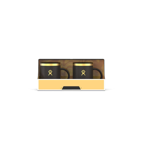 Two black mugs with a logo in a decorative box on a white background