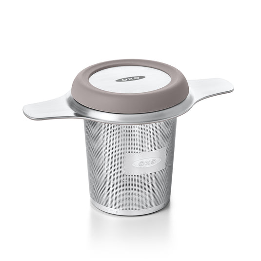 OXO tea infuser with a beige lid on a white background