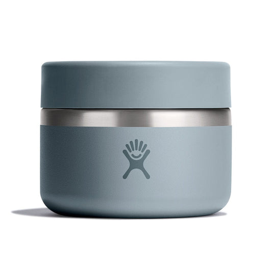 Blue thermos with silver base on a white background