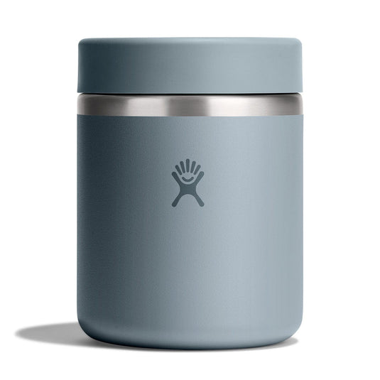 Blue insulated mug with a silver lid on a white background