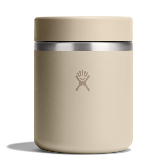 Beige insulated mug with silver lid on a white background