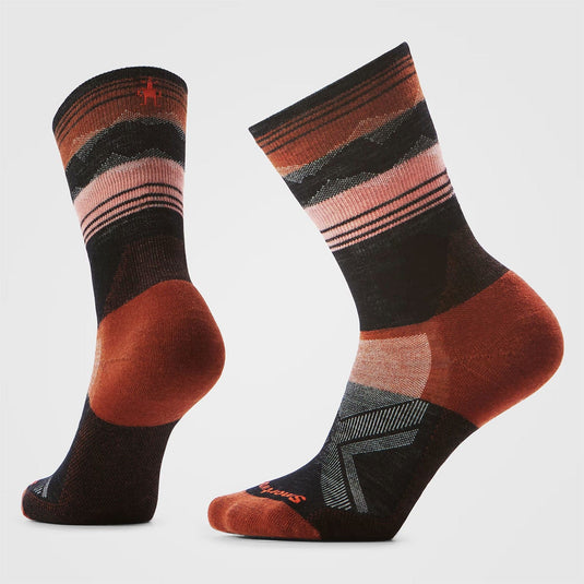 Pair of striped socks with brown, black, and pink colors on a white background