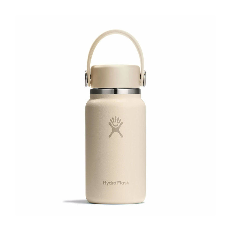 Load image into Gallery viewer, Beige Hydro Flask water bottle with a handle on a white background
