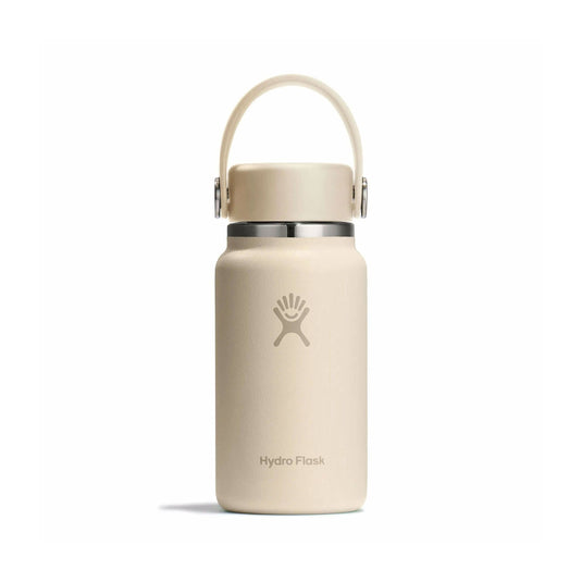 Beige Hydro Flask water bottle with a handle on a white background