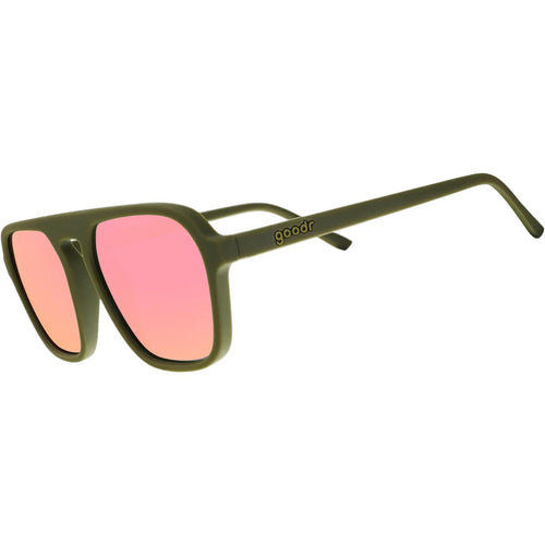Sunglasses with pink lenses and green frame on a white background