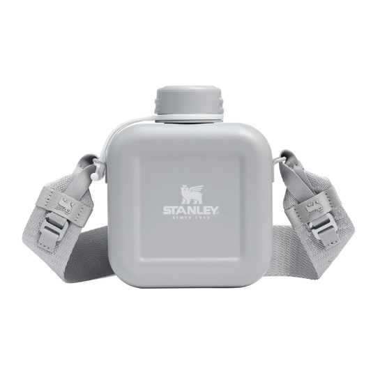 Gray water bottle with strap featuring Stanley logo on a white background