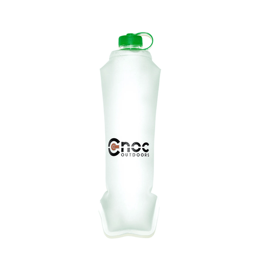 Silicone water bottle with green cap on a white background