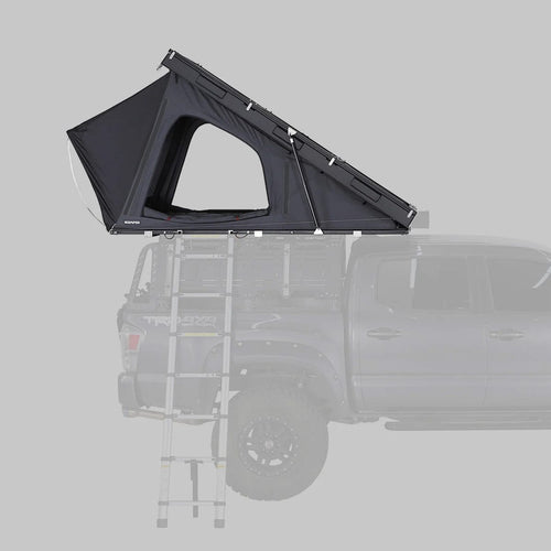 Black rooftop tent attached to a vehicle on a gray background