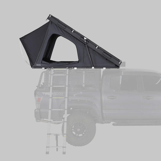 Black rooftop tent attached to a vehicle on a gray background