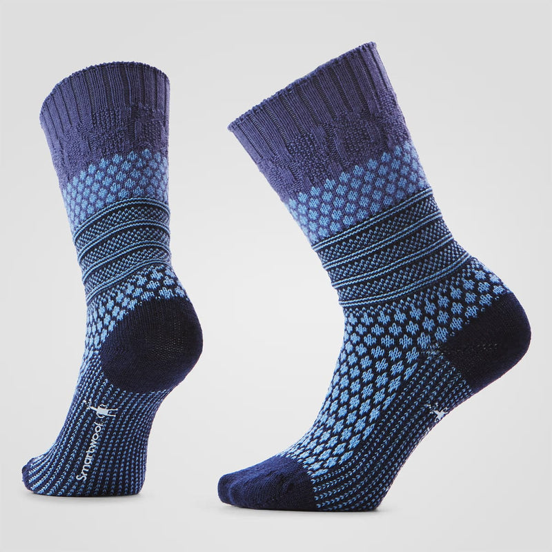 Load image into Gallery viewer, Pair of blue and black patterned socks on a light gray background
