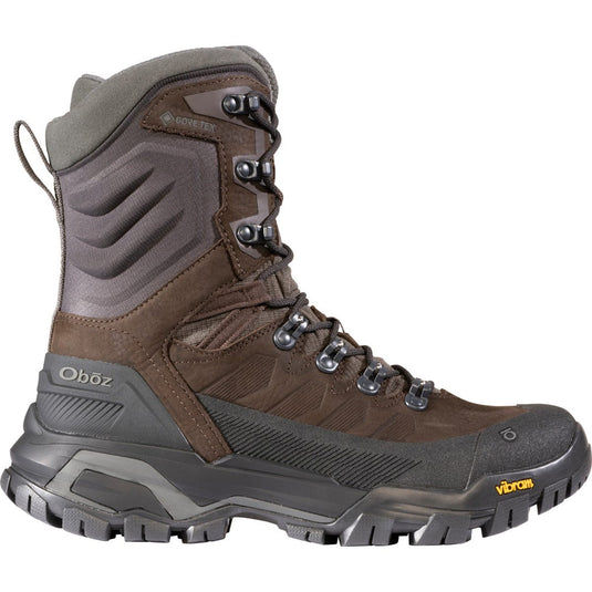 Brown and gray hiking boot with visible brand logos on a white background