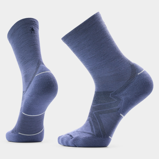 A pair of medium blue crew-length athletic socks shown on invisible forms against a light gray background.