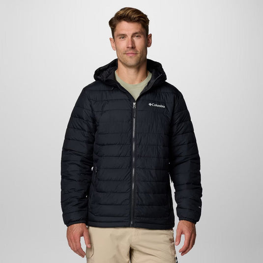 Man wearing a black puffer jacket with Columbia logo on a light gray background