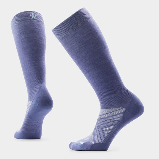 Pair of purple knee-high socks on a light gray background