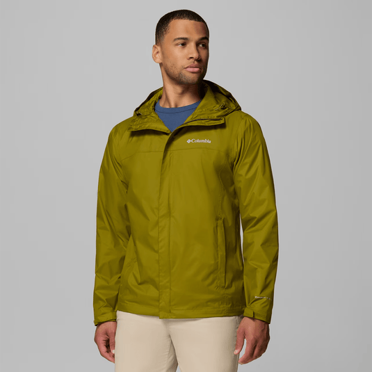 Man wearing a green Columbia jacket on a gray background