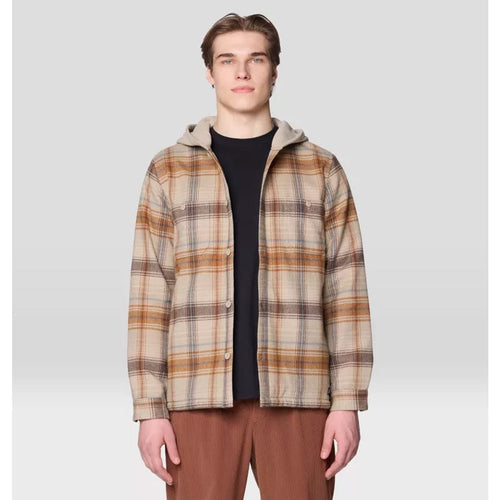 Man wearing a plaid jacket on a light gray background