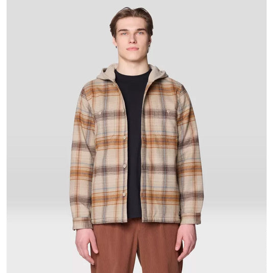 Man wearing a plaid jacket on a light gray background